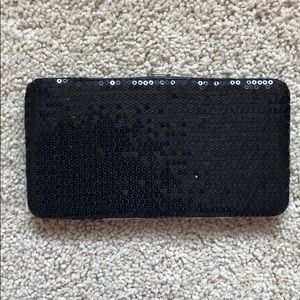 Claire’s black sequence evening wallet or bag.